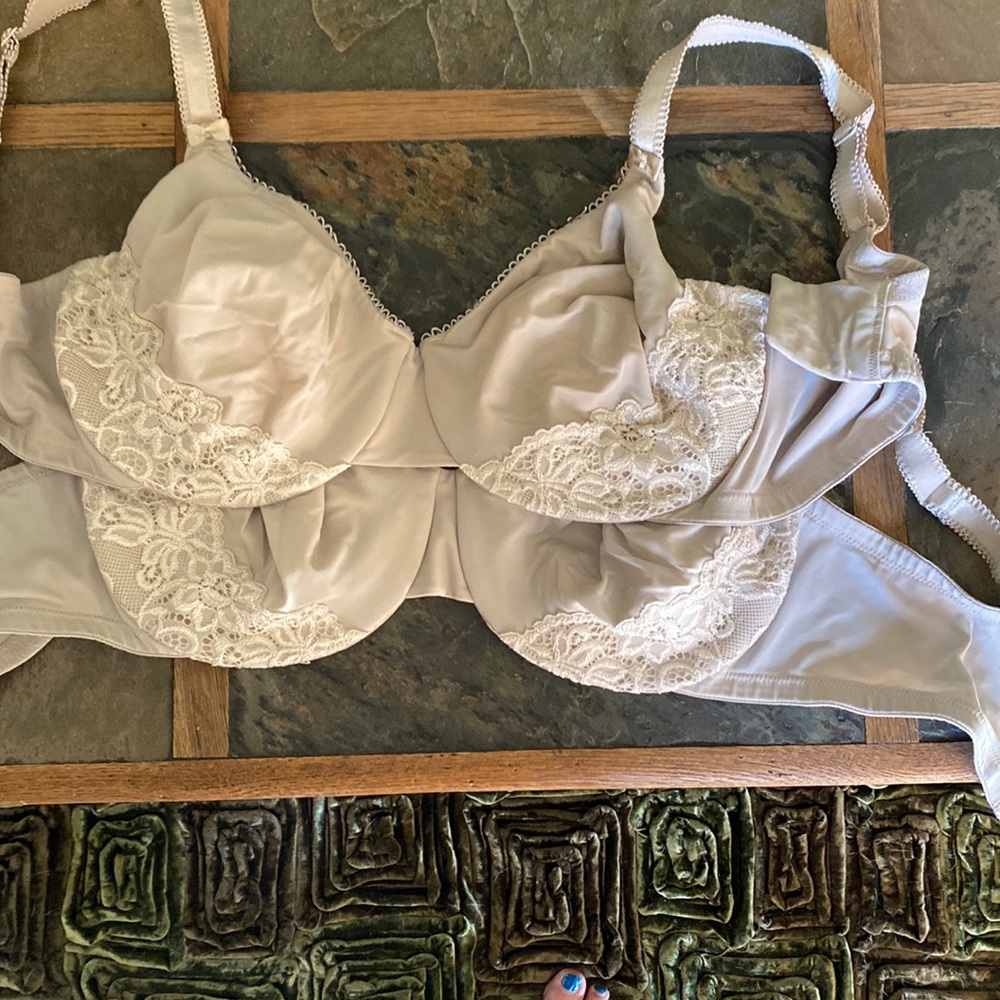 2 gently worn. Underwire, cream colored bras. Plunging neckline, great support.